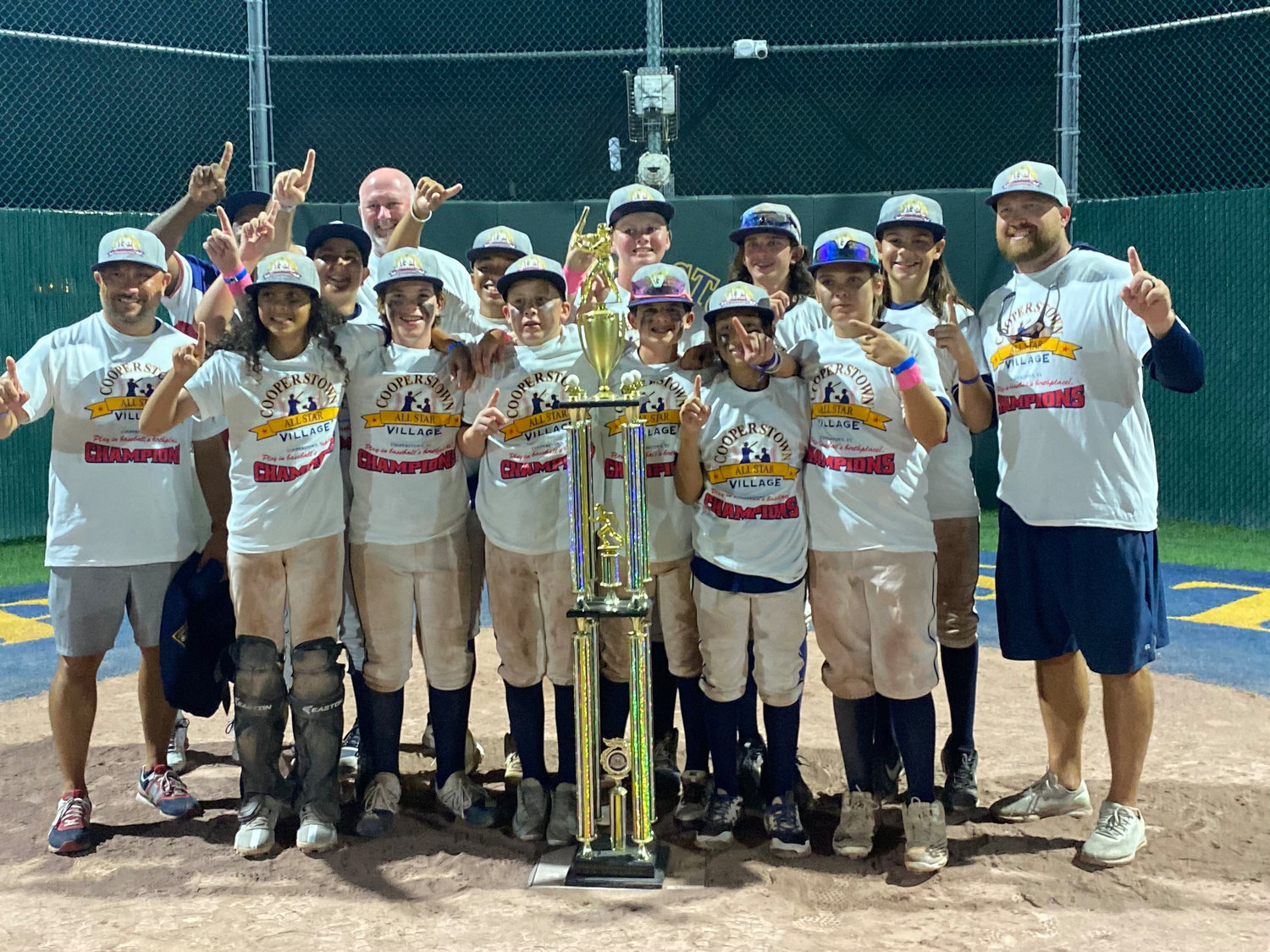 Members of the Ponte Vedra Thunder team celebrate their championship win at All Star Village in Cooperstown, New York.